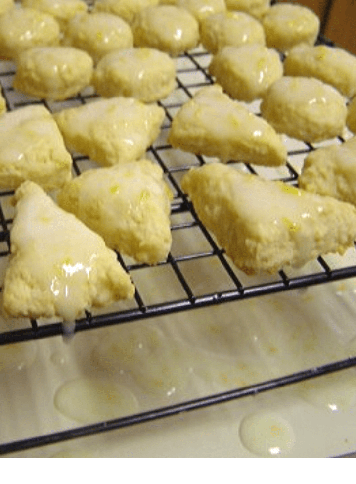 Mini lemon scones with glaze on cooling rack