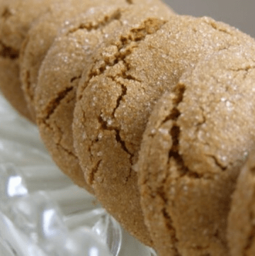 Line of several Starbucks Molasses Cookies in a glass serving dish.