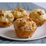 4 bacon and cheese muffins on a white plate