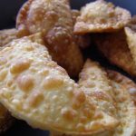 pile of cream cheese wontons on a plate