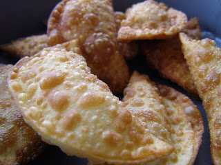 pile of cream cheese wontons on a plate