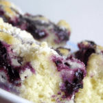 Pieces of blueberry coffee cake on a white plate