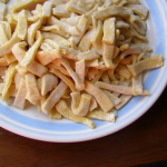 Plate full of prepared homemade egg noodles recipe ready to be boiled